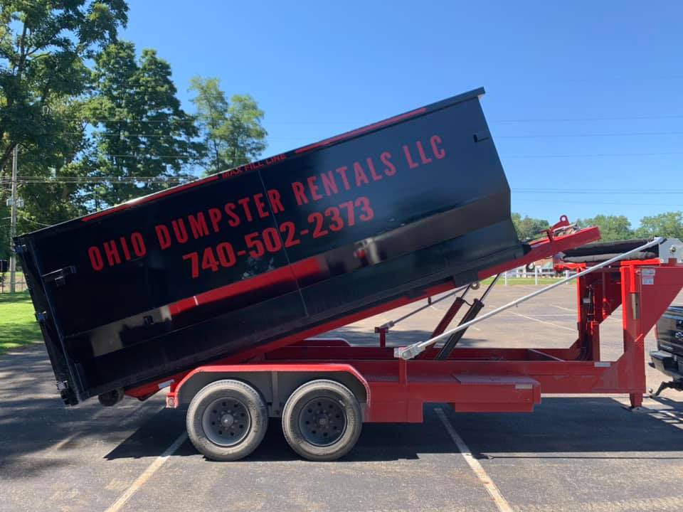 Roll-off dumpster set at an incline with contact information for Ohio Dumpster Rentals near Mount Vernon, OH