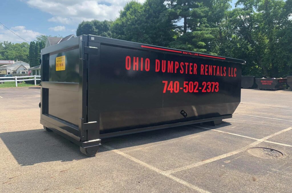 An 11 yard roll-off dumpster from Ohio Dumpster Rentals set in a parking lot