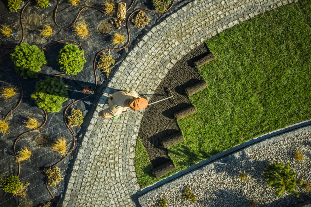 A landscaper working on a lawn