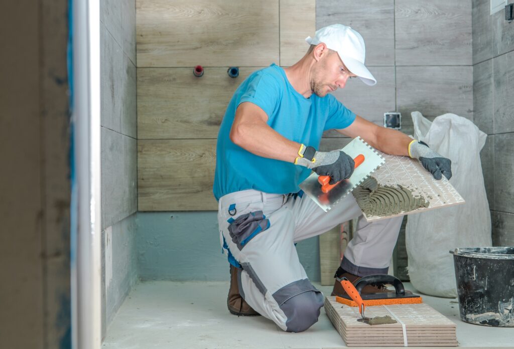 Tile installer remodeling a bathroom
